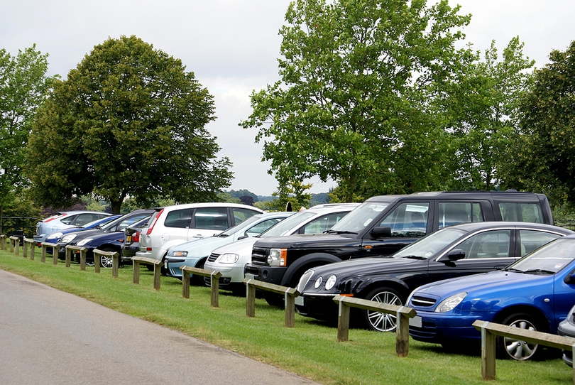 Cars Parked in Field
