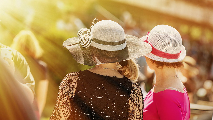 Women Wearing Hats at a Summer Race Meeting